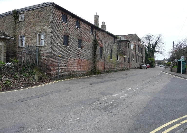 Mill Lane, Eastry, with the former hospital buildings running alongside the road