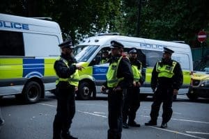 Police officers with vans at scene