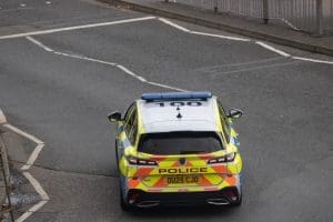 Police car at junction from above