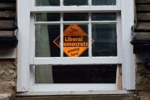 A Liberal Democrat "Winning Here" campaign placard from a UK general election.