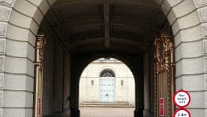 The stone archway and gates at Sessions House, County Hall, Maidstone, looking through to the inner courtyard